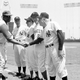 Luke Easter shakes Casey Stengel’s hand at an old-timers; game at Anaheim Stadium in the 1970s. Other players, from left, are the DiMaggio brothers: Joe, Dom and Vince.